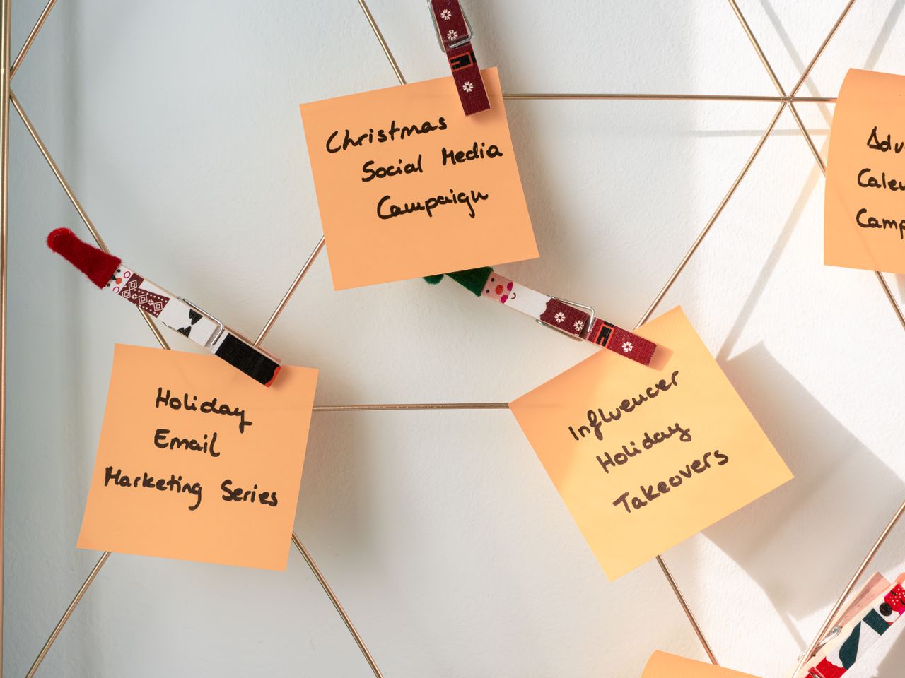 services-02 Sticky notes with holiday marketing ideas for Christmas social media and email campaigns.